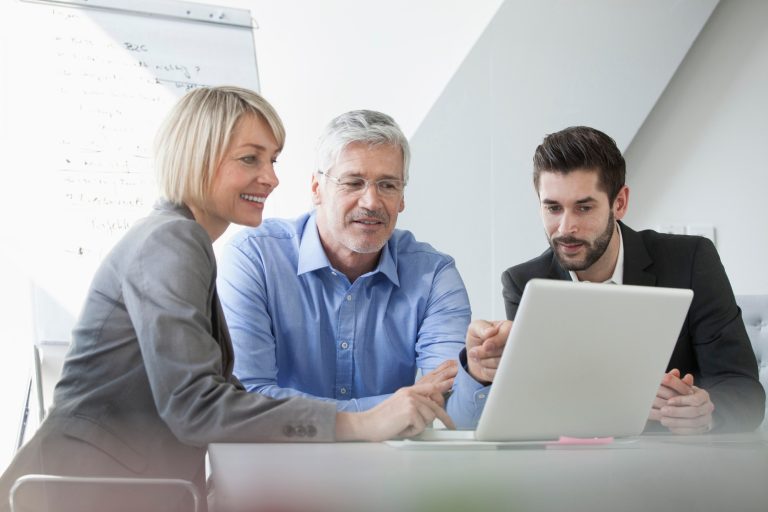 technician providing support to a computer user, symbolizing IT support services