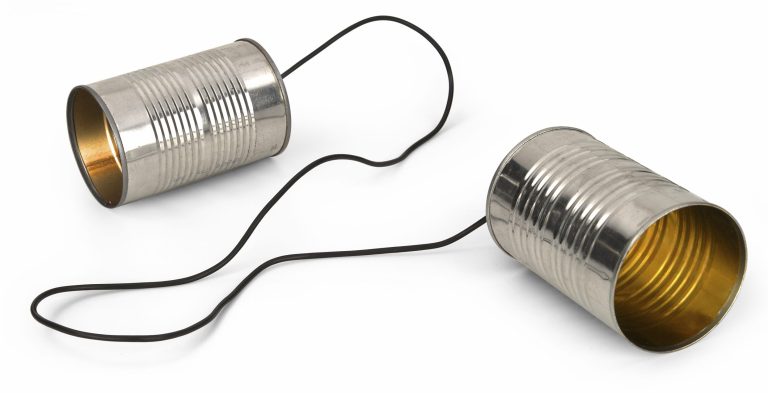 Two metal cans connected by a string,representing legacy PBX systems for traditional telephony infrastructure.