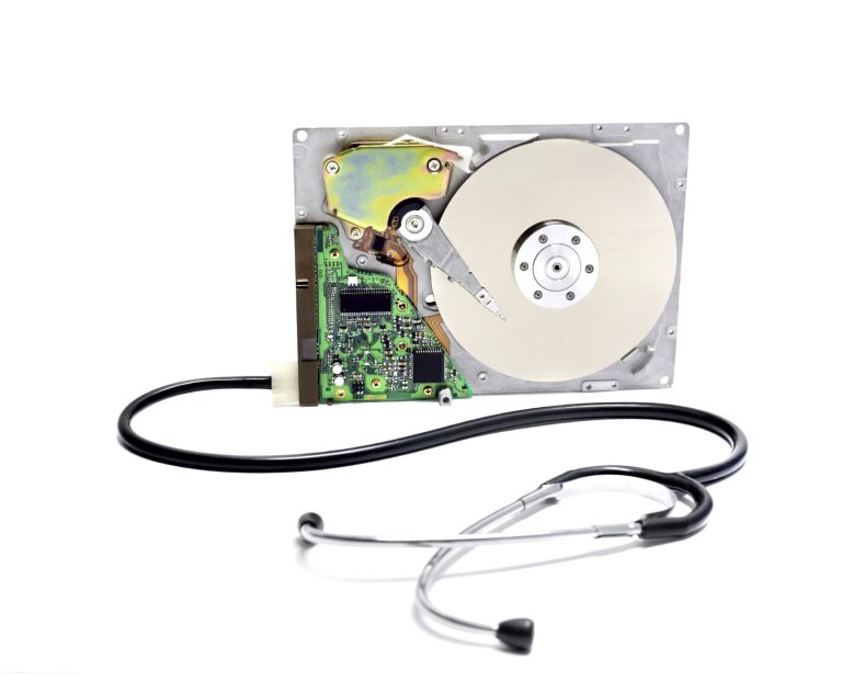 hard drive being examined with a stethoscope